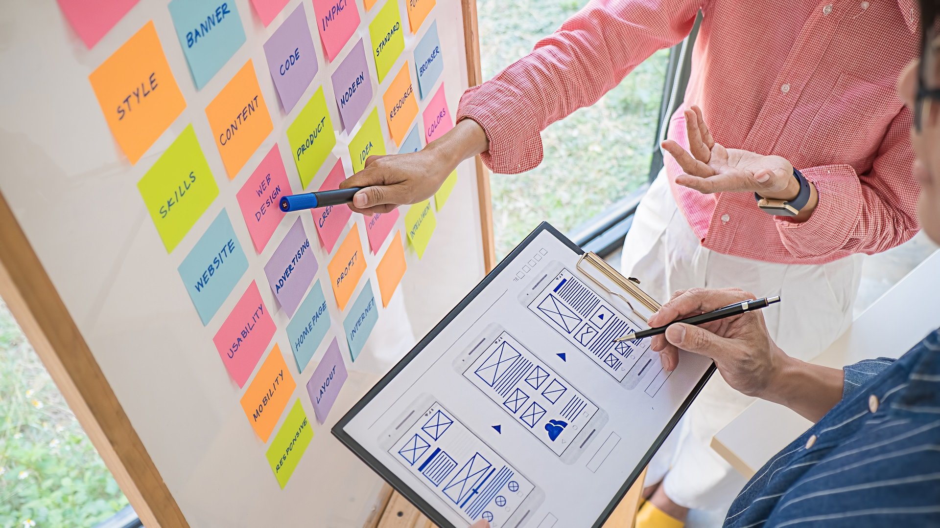 web-designer-brainstorming-for-strategy-plan-colorful-sticky-notes-with-things-to-do-on-office-board-user-experience-ux-concept